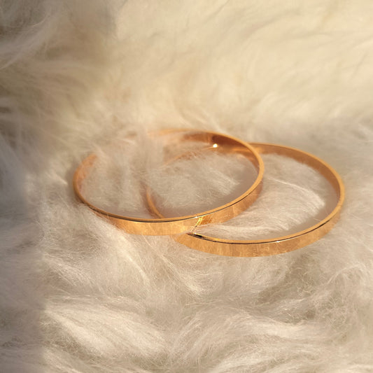 2 PIECES OF METAL BANGELS